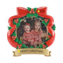 Red bow and holly Christmas picture frame ornament with a photo of two children, personalized with an example phrase on the banner and a year on the bow.