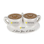Personalized I Love You A Latte couple ornament with two white coffee cups on a saucer, names on each cup, a year between them, and heart latte art.