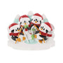Ice fishing penguin family ornament for four with penguins in Santa hats gathered around an ice hole with fish and snowy mountains.