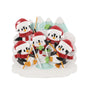 Ice fishing penguin family ornament for five with penguins in Santa hats fishing around an ice hole with snowy mountains in the background.