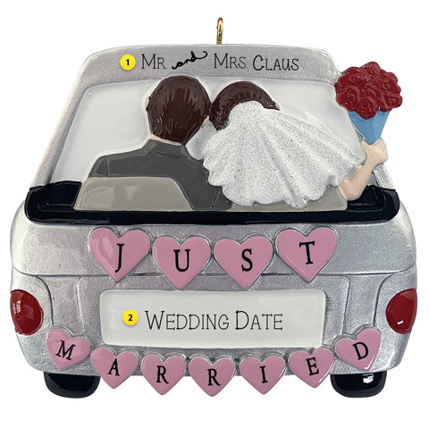 Decorative ornament of a wedding couple in a car with 'Just Married' can be personalized.