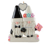 Decorative ornament of two gnomes in wedding attire with flowers and a heart.