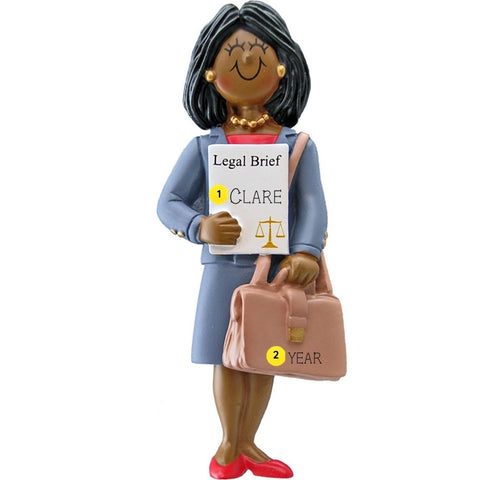 Ornament of a woman holding a legal brief and a briefcase on a white background personalized with name and year.