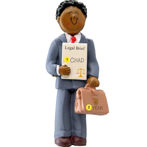 Ornament of a lawyer holding a 'Legal Brief' personalized with name and year and a briefcase on a white background