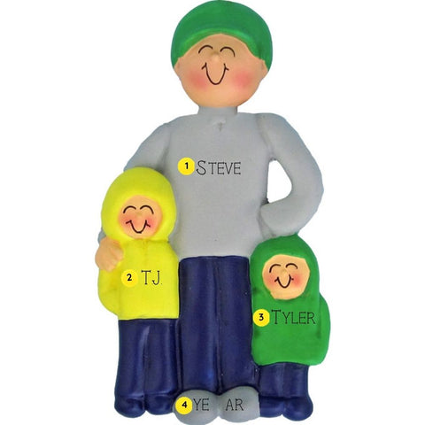 Personalized ornament of a father holding two children on a white background