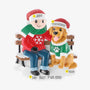 Personalized man and his dog ornament with names on the Santa hats, a phrase on the snow, and the year beside them.