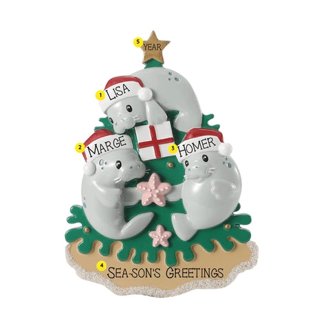 Personalized manatee family ornament for three with example names on Santa hats, a short holiday phrase across the sand, and a year.