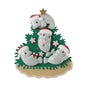 Manatee family ornament for four with manatees in Santa hats decorating a coastal Christmas tree with starfish accents.