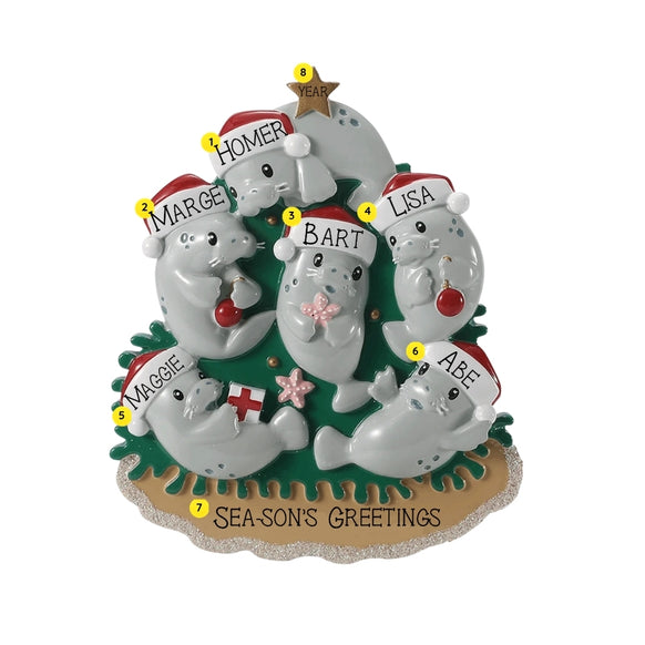 Personalized manatee family ornament for six with example names on Santa hats, a short holiday phrase across the sand, and a year.
