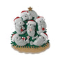 Manatee family ornament for six with manatees in Santa hats gathered around a coastal Christmas tree with beachy holiday details.