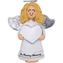 Angel figurine with blonde hair, white wings, and a heart, holding 'In Loving Memory' on a white background.