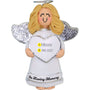 Angel ornament with blond hair holding a heart-shaped plaque in loving memory with personalized name and years on a white background