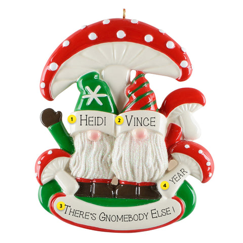 Decorative Christmas ornament with two gnomes under a mushroom, personalized with names and text.