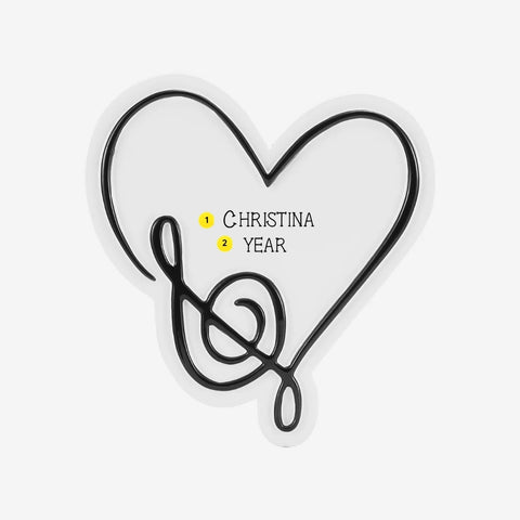 Personalized musical note heart ornament with a name and year added inside the heart.