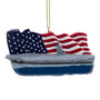 U.S. Navy™ aircraft carrier ornament with gray ship, waving American flag background, blue personalization area, and gold hanging cord.