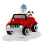 Decorative ornament with a boy driving a red off road vehicle and a dog on a white background