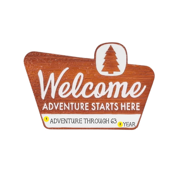 Personalized park welcome sign ornament with a short phrase and year added to the white banner.
