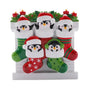 Penguin family of five ornament with colorful Christmas stockings, Santa hats, holly, and candles.