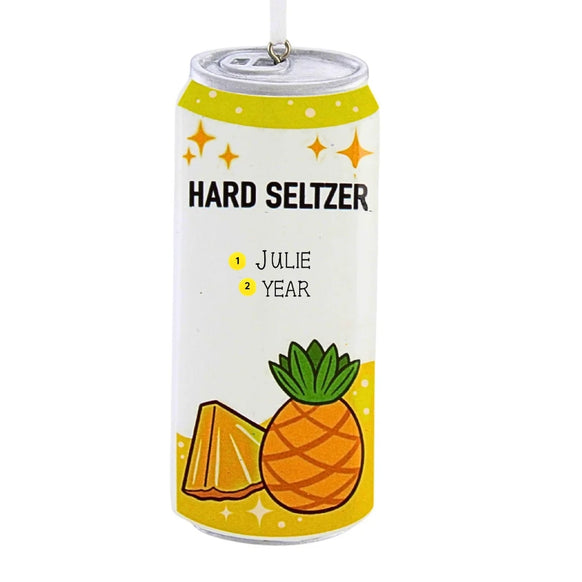 Personalized pineapple hard seltzer can ornament with a name and year on the front.