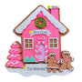 Decorative gingerbread house with pink walls, gingerbread people, and a wreath on a white background.