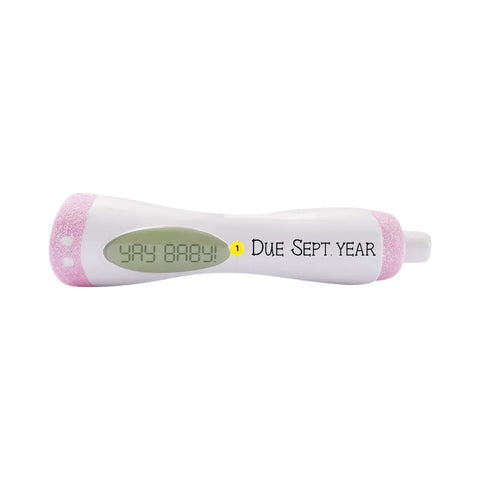 Personalized pink pregnancy test ornament with Yay Baby message and due date placement shown.