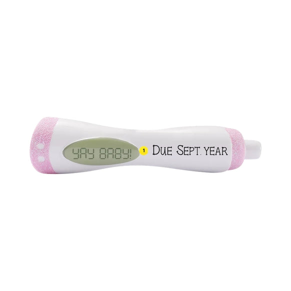 Personalized pink pregnancy test ornament with Yay Baby message and due date placement shown.