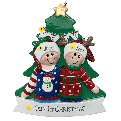 Personalized Christmas ornament with two people in front of a Christmas tree, wearing sweaters and hats.