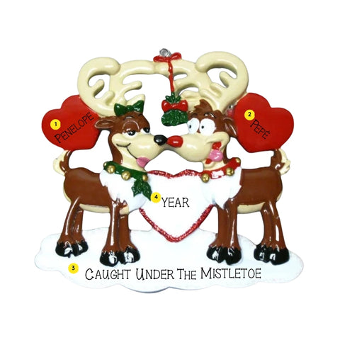 Personalized reindeer couple ornament with names written on the red hearts, a phrase along the snow base, and the year added on the center heart.