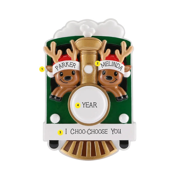 Personalization example alt: Two-reindeer Christmas train ornament personalized with two names on the Santa hats, a year on the train front, and “I Choo-Choose You” on the white banner.