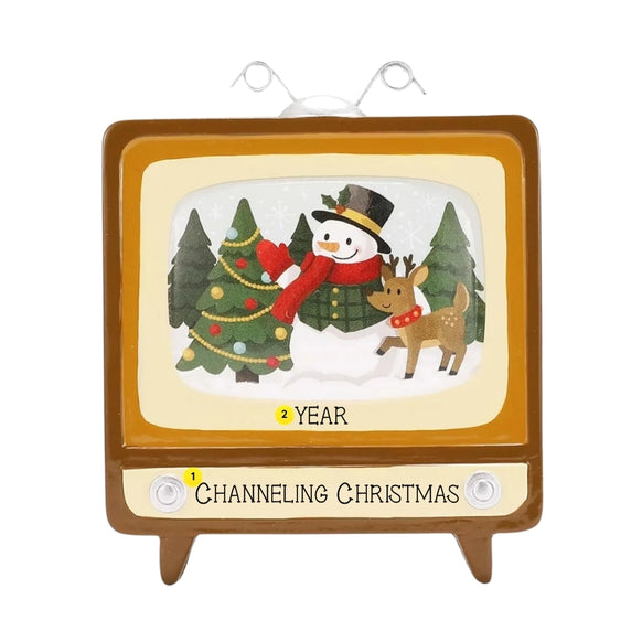 Personalized retro TV Christmas ornament with an example short phrase on the bottom panel and space for a year below the screen.