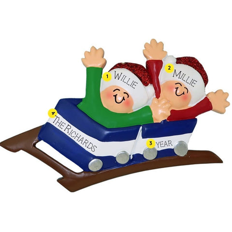 Personalized Christmas ornament of two people on a roller coaster with names and year details.
