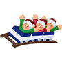 Christmas ornament of three people on a rollercoaster with santa hats on a white background