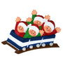 Decorative figurine of four people in Santa hats on a roller coaster with a white background