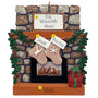 Decorative Christmas ornament of a stone fireplace with stockings and personalized names.