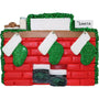 Christmas ornament of a mantel with stockings against a white background