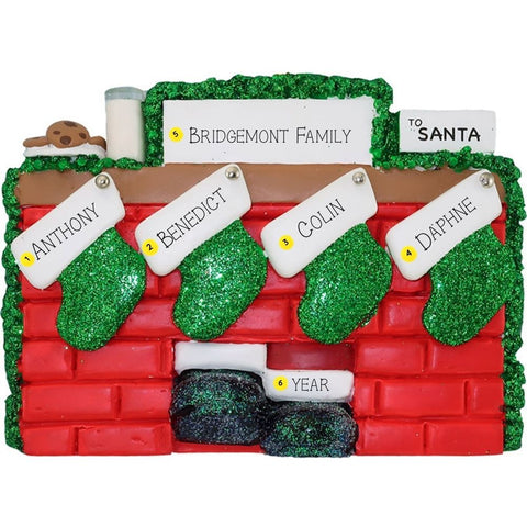Christmas ornament of a mantel with personalized stockings against a white background