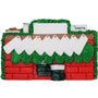Decorative Christmas ornament shaped like a chimney with a Santa Claus figure at the base with stockings hung on a white background.