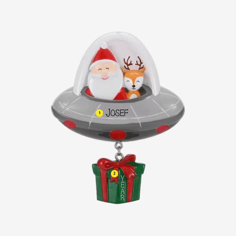 Personalized Santa and reindeer UFO ornament with a name on the flying saucer and space for a year on the present.