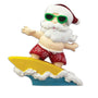 Surfing Santa Christmas ornament with Santa in green sunglasses, red swim trunks, and a Santa hat riding a yellow surfboard over blue waves.