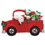 Christmas ornament of a red truck with Santa Claus and reindeer on a white background