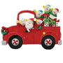 Decorative Christmas ornament of a red truck with Santa and children, on a white background.