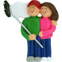 Ornament of a couple holding a selfie stick on a white background