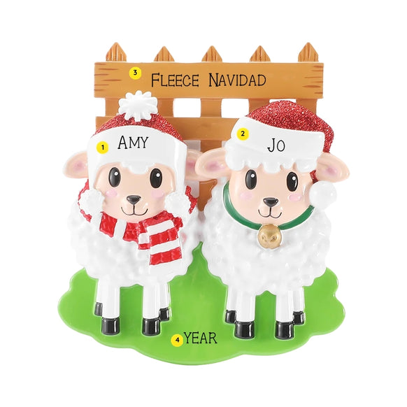 Personalized sheep family of 2 ornament with two sheep in Santa hats by a wooden fence, personalized with example names, phrase, and year.