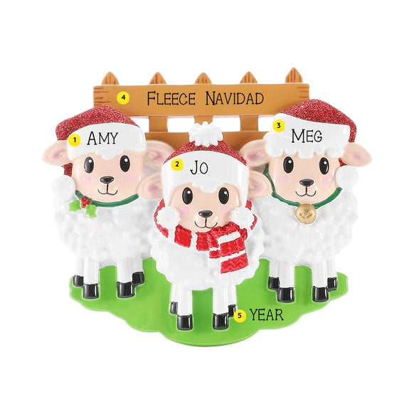 Personalized sheep family of 3 ornament with three sheep in Santa hats by a wooden fence, personalized with example names, phrase, and year.