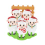 Sheep family of 5 ornament with five sheep in Santa hats by a wooden fence.