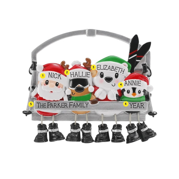 Ski lift ornament with Santa, reindeer, polar bear, and penguin sitting together in winter hats with skis and dangling boots.