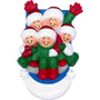 Ornament of five smiling figures riding a blue sled through snow in matching winter clothes.