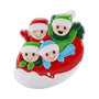Family of 4 ornament with four smiling figures in winter hats on a red and white snow tube