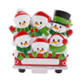 Snowman family of six ornament riding together in a red holiday truck with cheerful winter accessories.