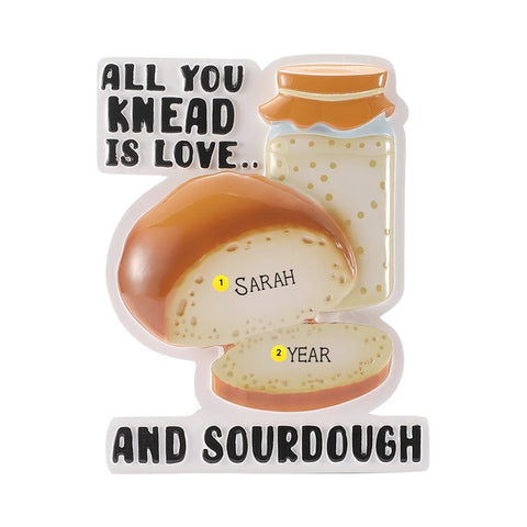 Personalized sourdough starter ornament with a name on the bread loaf and the year written on the sliced bread.